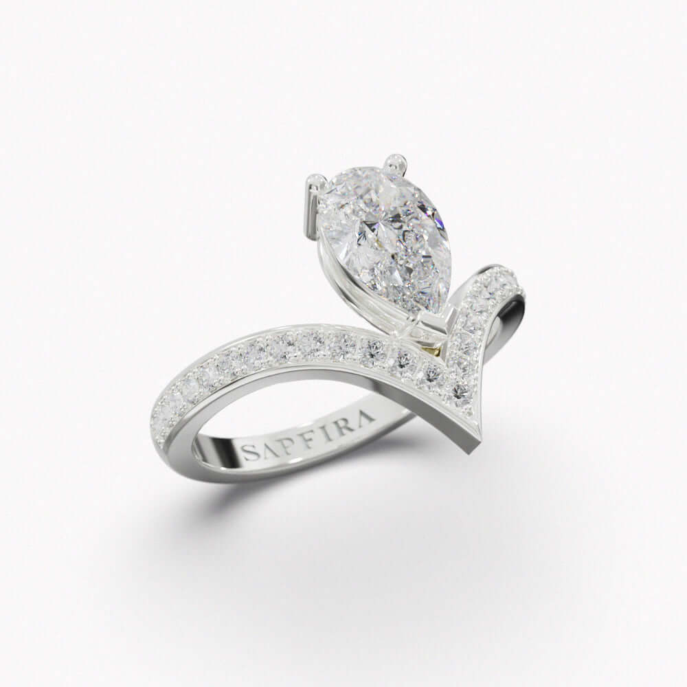 PEAR DIAMOND RING - SAPFIRA gold Ring Natural Diamond Ring in 18k white gold. Central stone: 1 ct Delicate pear shape and pavé diamonds , evoking a geometric elegance that is beautifully asymmetric.