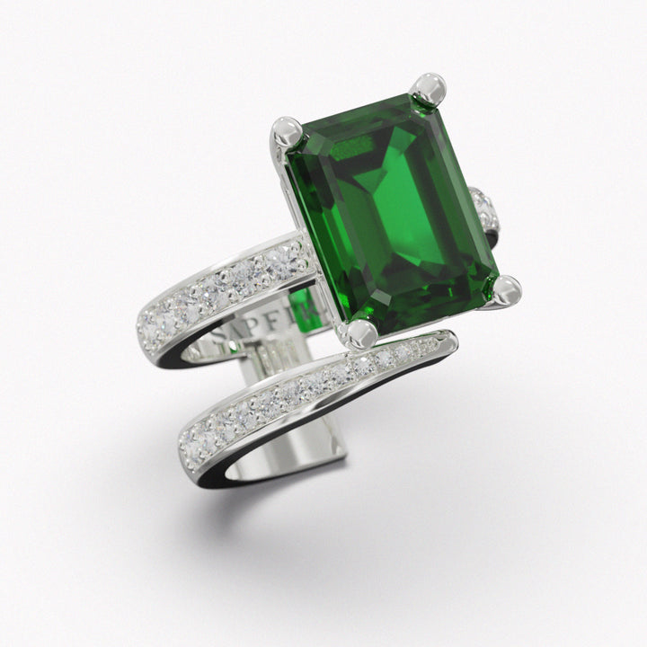 TOURMALINE COCKTAIL RING - SAPFIRA gold Ring  Our White Gold 18K Green Tourmaline & Diamond Ring crafted from 18 karat white gold, its sleek design features a captivating green tourmaline center stone flanked by pavé diamonds. With its minimalist yet sharp lines, this ring effortlessly combines contemporary style with timeless elegance, perfect for making a refined statement on any occasion.