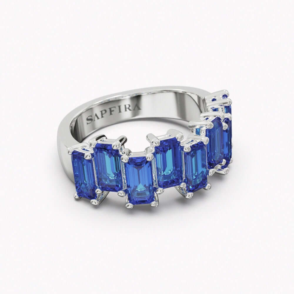 ABYSSE - SAPFIRA gold Ring  1/2 band sapphire ring in 18k white gold. Total carat weight 3.74ct.Sapphire is a stone of wisdom and royalty, of prophecy and divine favor. It was a symbol of power and strength, but also of kindness and wisdom.