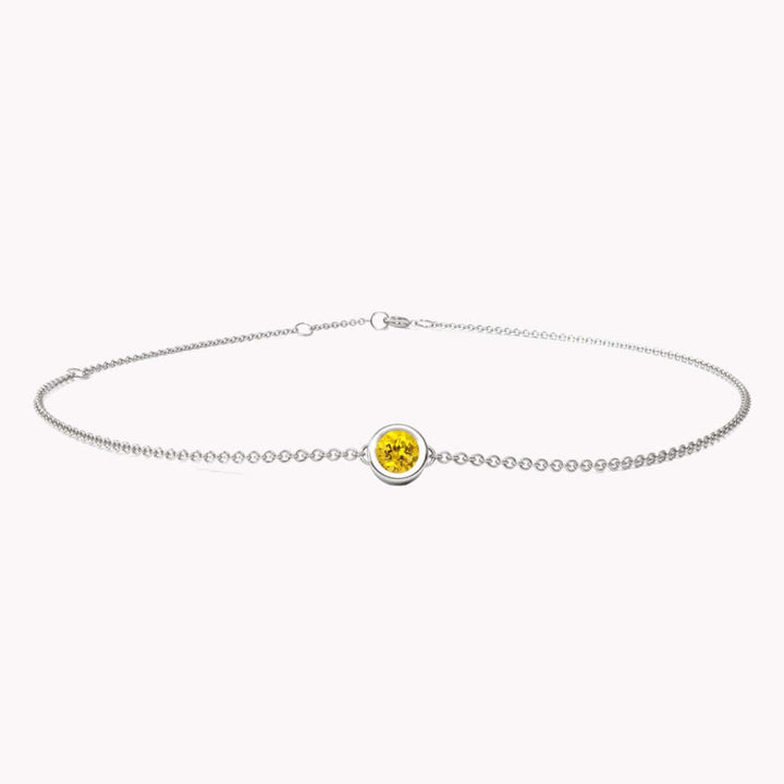I AM HAPPY - SAPFIRA Bracelet  “Joy is the essence of my being”“I have the power to shape my ideal reality”"I'm supposed to live a happy life"Yellow Sapphire is the stone of prosperity and success, fiery and energetic, it will help you achieve all those big dreams you have.A feminine bezel set bracelet in solid 14k gold.One size with three hooks at 14.5 cm, 16 cm and 18 cm