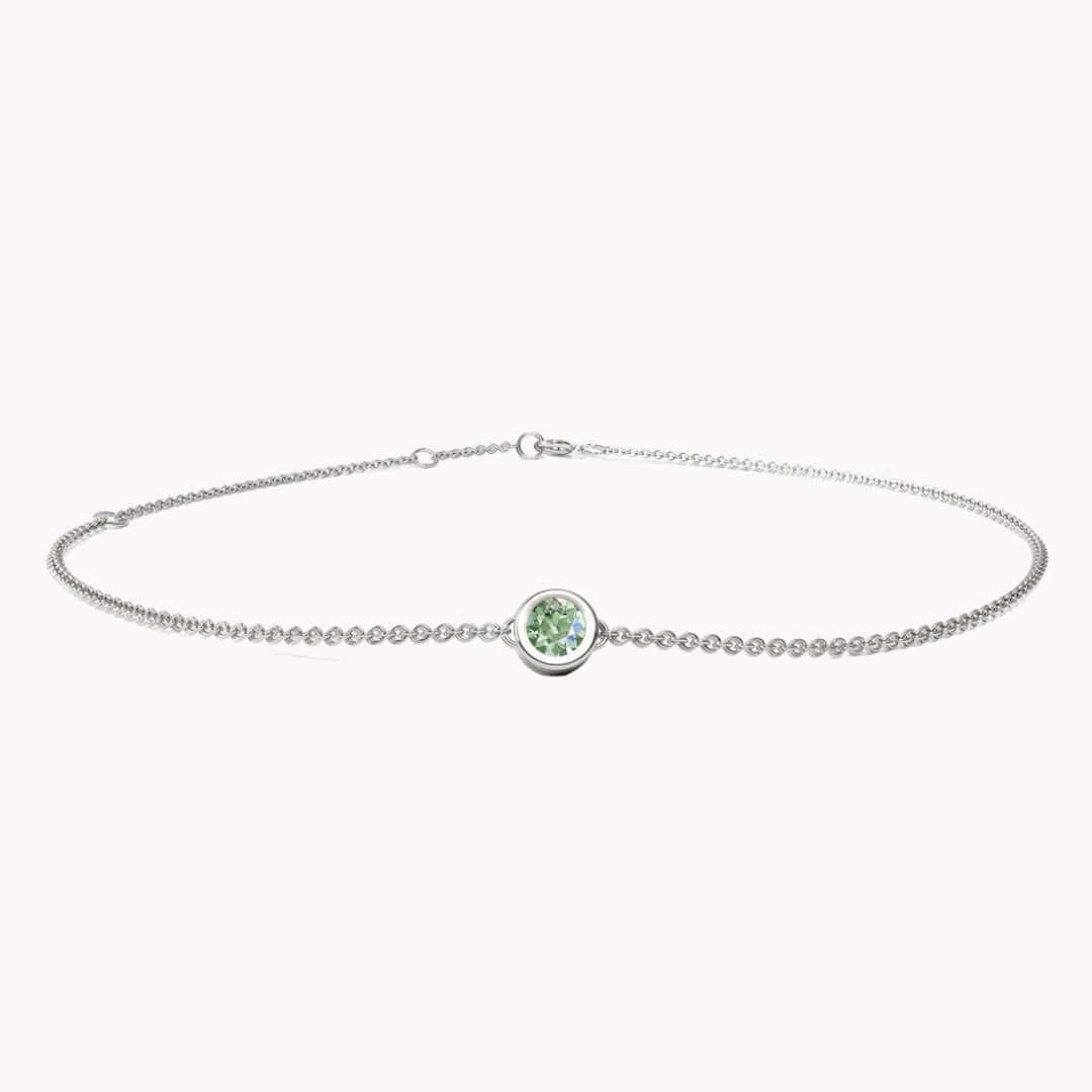 I AM HEALTHY - SAPFIRA Bracelet  “I am healthy, happy and radiant”“I am surrounded by a healthy environment”“I feel dynamic”Stone of tranquility, green sapphire, will bring joy and lightness to your life. As well as restoring balance in your body and mind.A feminine bezel set bracelet in solid 14k gold.One size with three hooks at 14.5 cm, 16 cm and 18 cm