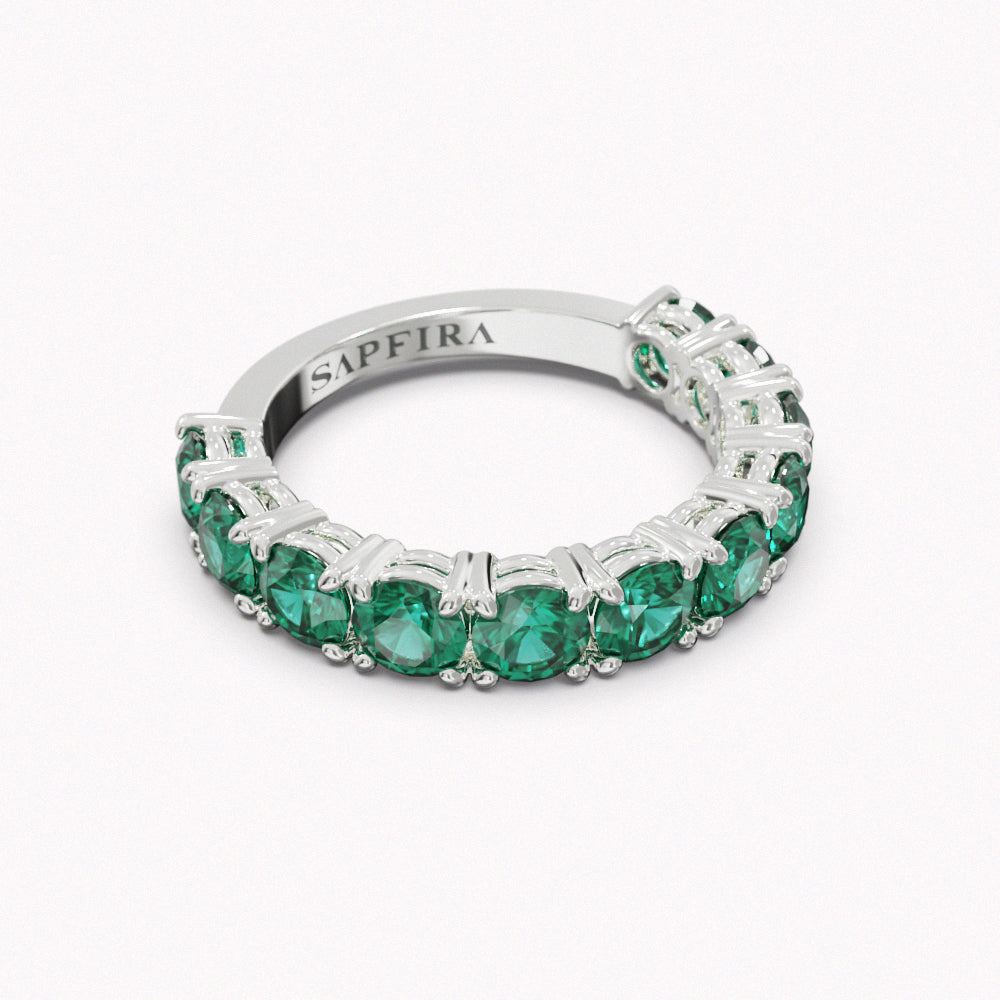 JUNGLE - SAPFIRA gold Ring  Classic emerald ring, 18 karat gold. 3/4 band: 11 Brazilian Emeralds, 3 ct total weight. Width: 4 mm