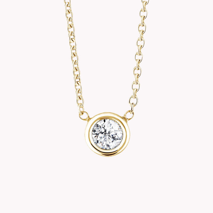 BEZEL DIAMOND NECKLACE - SAPFIRA Colliers  A simple and beautiful feminine bezel set diamond necklace in solid 18k yellow, white or rose gold. A perfect birthday gift and a piece of beautiful diamond jewelry.Chain length: 45 cmAvailable in 3 sizes 0.10, 0.30, and 0.50 carats.